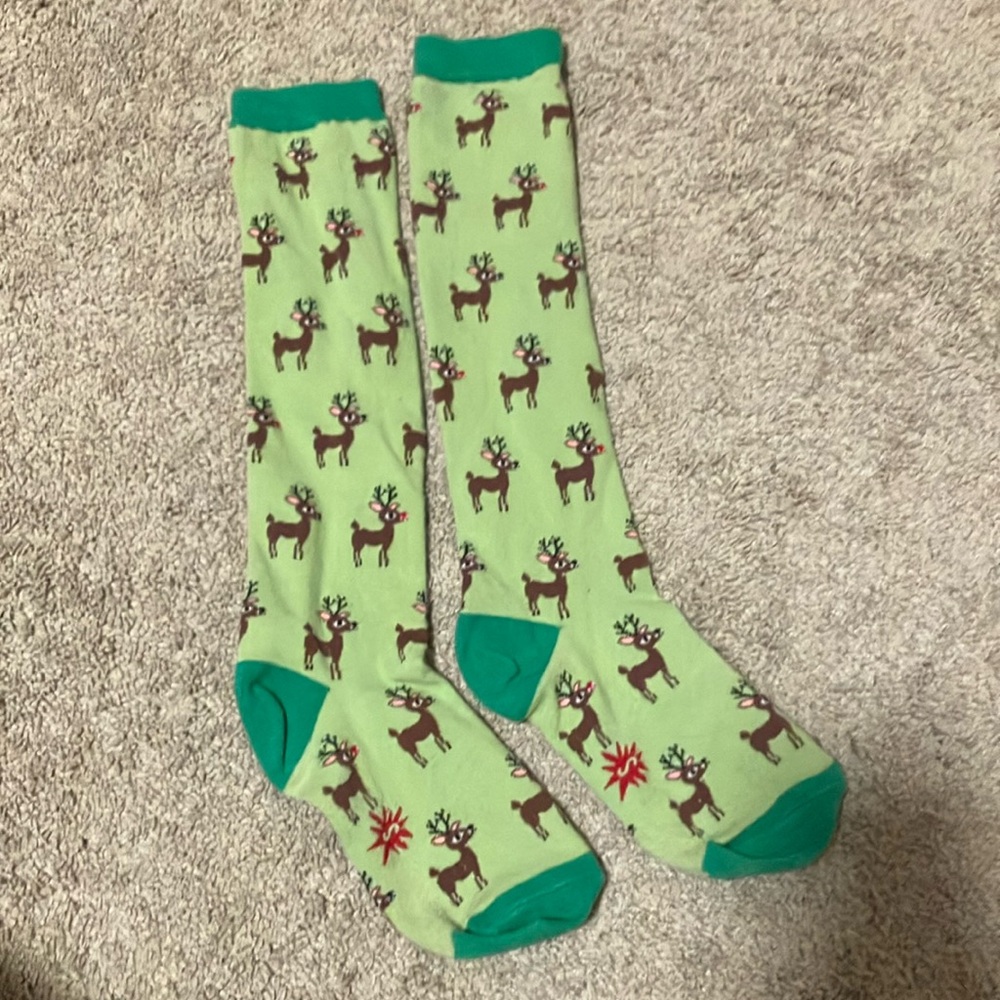 Knee socks with repeated Rudolf the Red Nosed Reindeer pattern